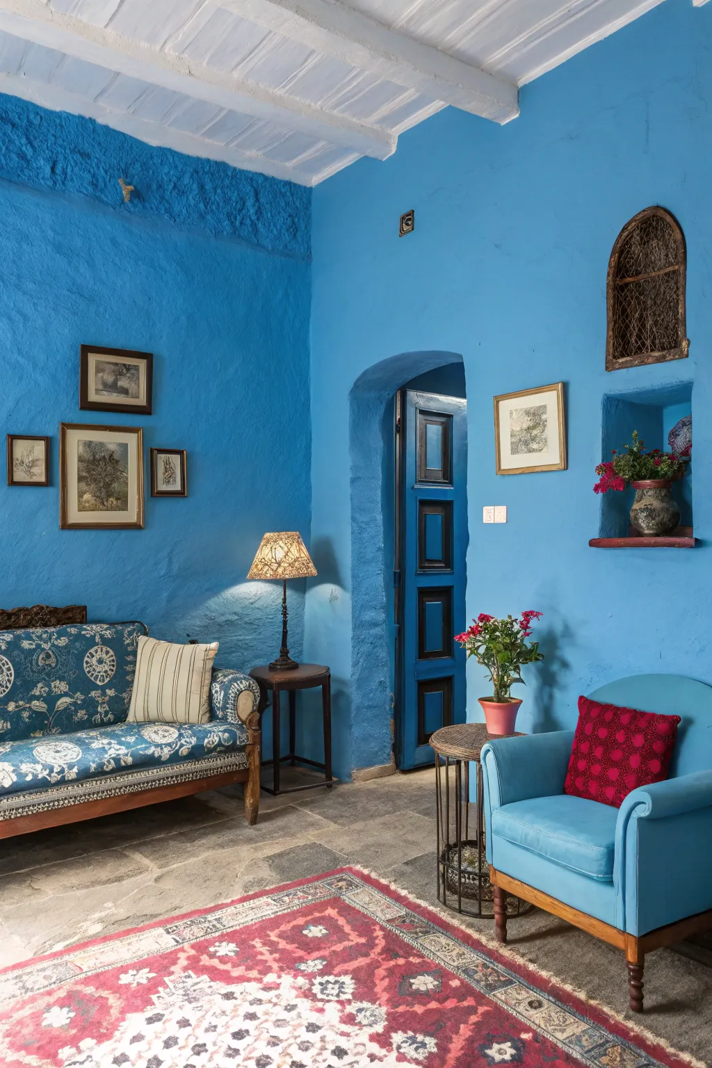 A striking room with bold blue walls and contrasting decor.