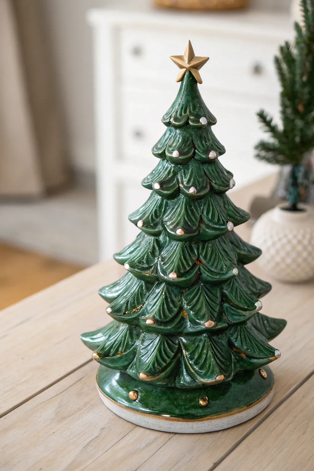 Elevate your holiday decor with a ceramic Christmas tree that combines traditional green with modern metallic accents for a stunning evergreen masterpiece.