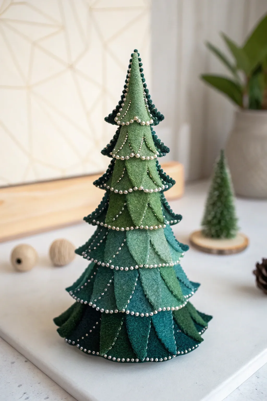 Embrace the festive spirit with a touch of handmade elegance: a charming felt Christmas tree to adorn your home.