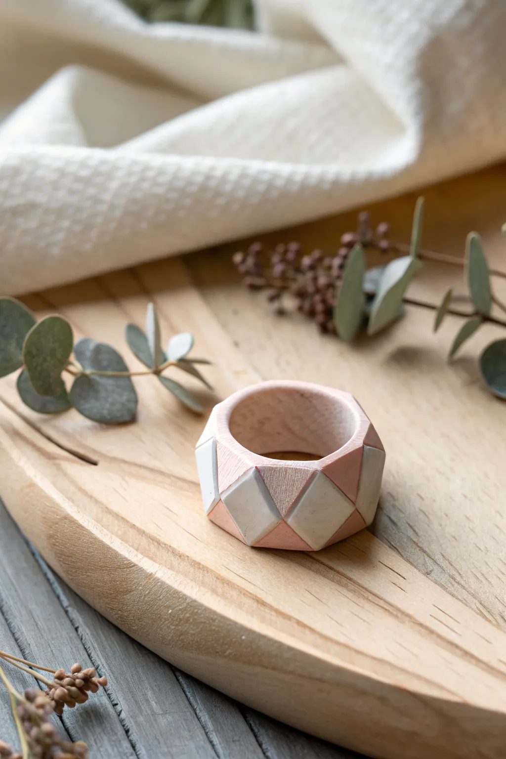 Modern elegance meets artisanal charm with this geometric clay ring.