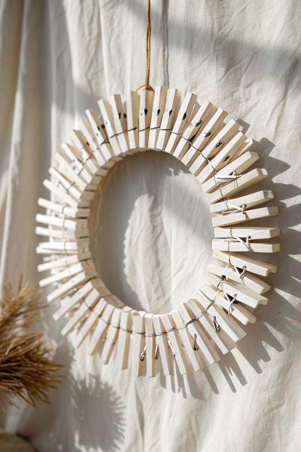 Embrace the serenity of simplicity with this elegant monochrome clothespin wreath.