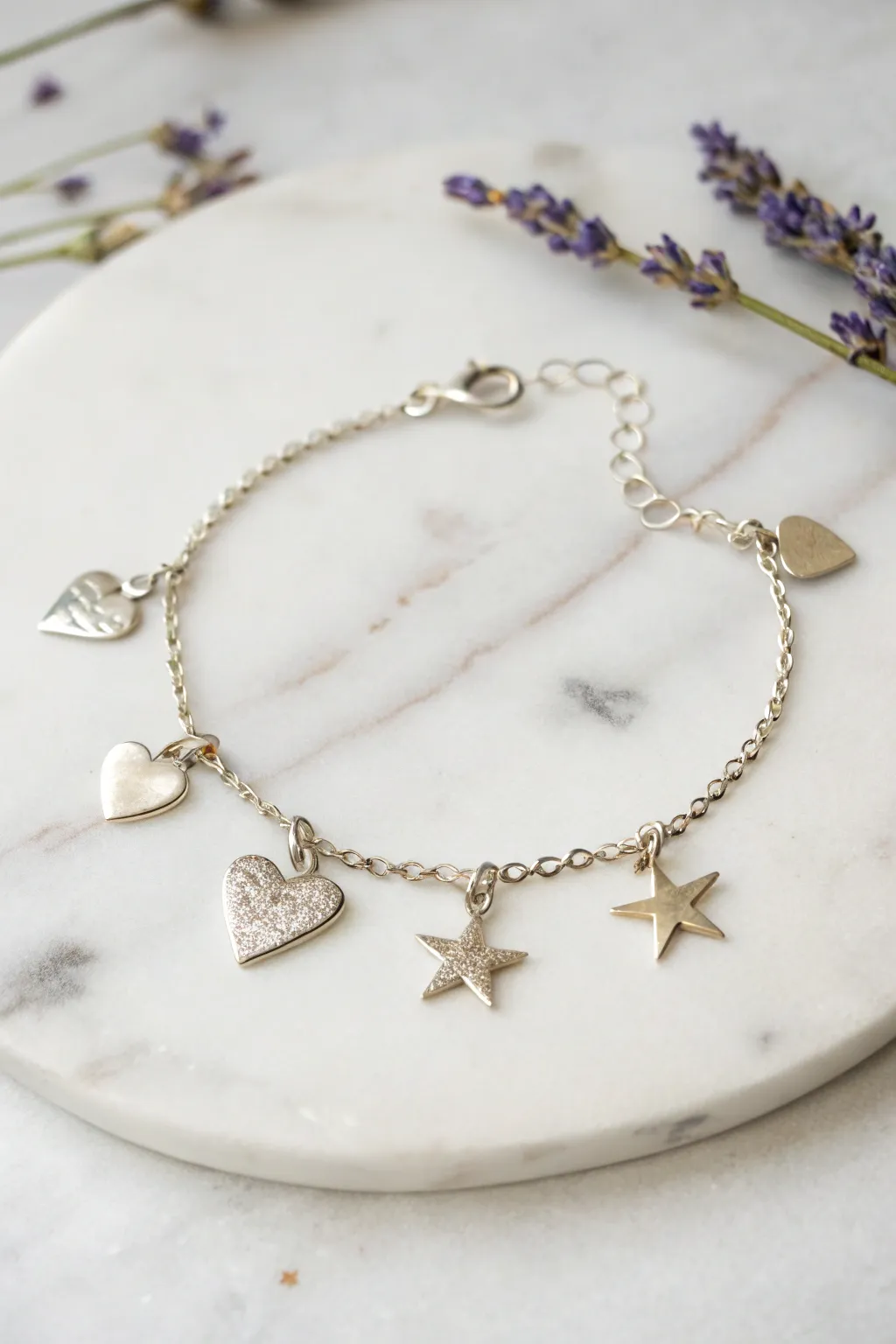 Embrace the elegance of simplicity with metallic star and heart charms, perfect for your DIY bracelet creations.