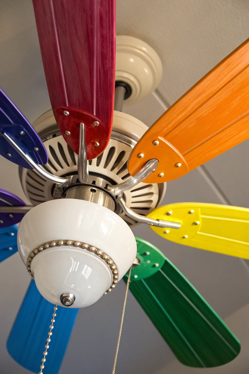 Transform your space with a burst of color — paint your fan blades into a rainbow masterpiece!