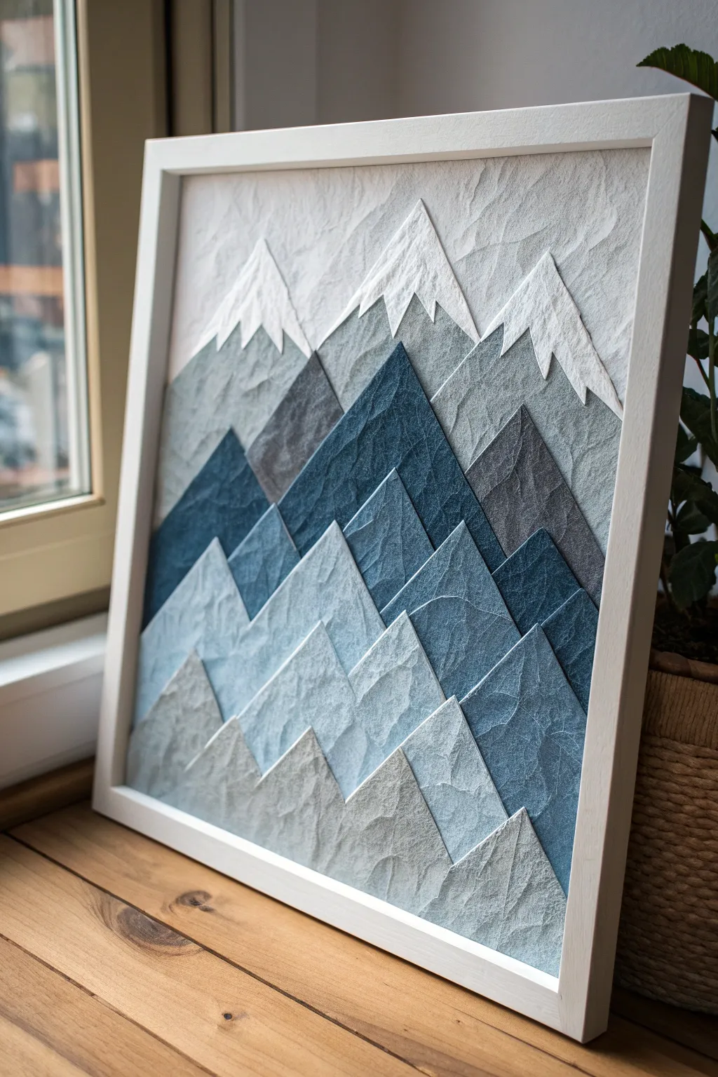 Discover the serenity of majestic mountains through the art of collage, where simplicity meets natural elegance.