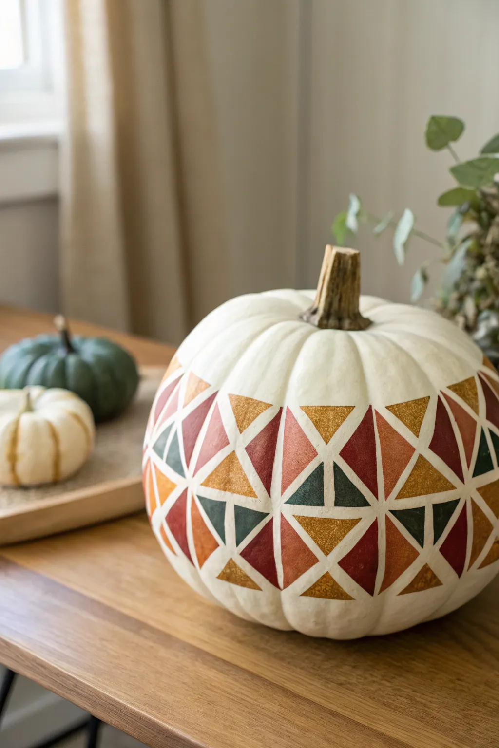 Transform your autumn decor with a touch of modern elegance: Geometric Painted Pumpkins.