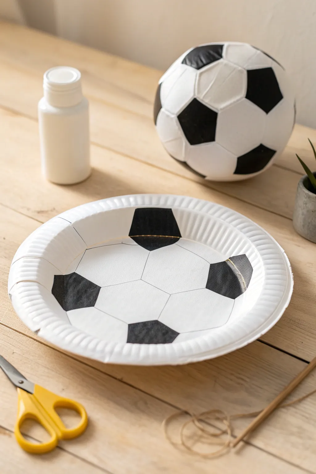 Craft a little piece of the beautiful game with this simple paper plate soccer ball, perfect for sparking joy in young hearts!
