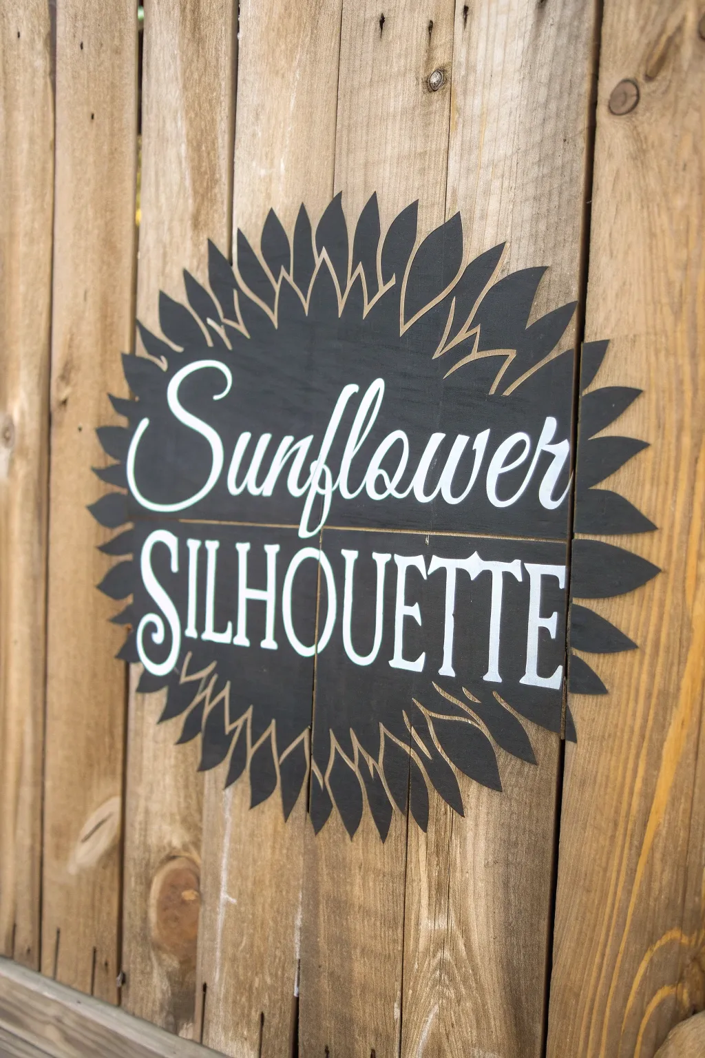A timeless sunflower silhouette paired with vintage typography.