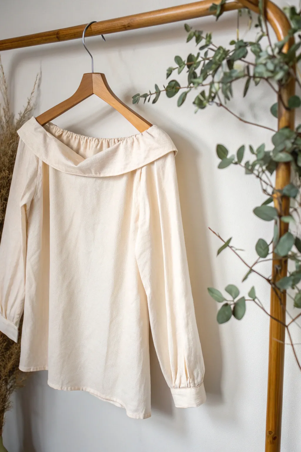 Reinvent your wardrobe: A simple cut transforms an old shirt into a chic off-shoulder summer staple. 🌿 #UpcycleFashion #MinimalistStyle