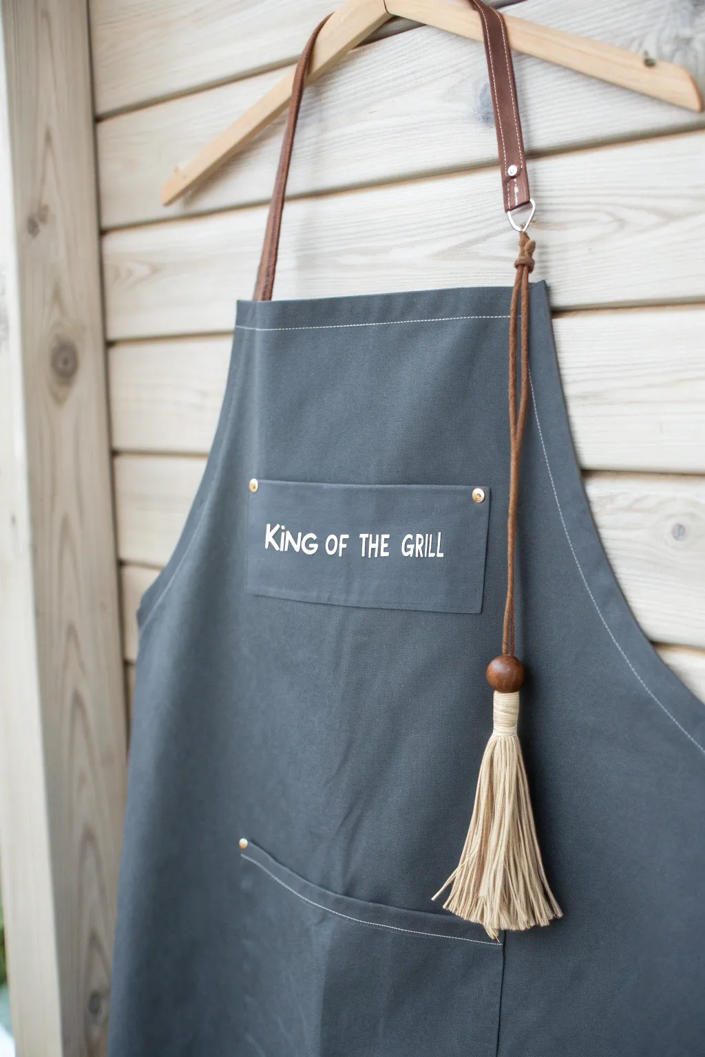 Elevate your BBQ game with a chic and sturdy apron that blends function with style. #GrillMaster