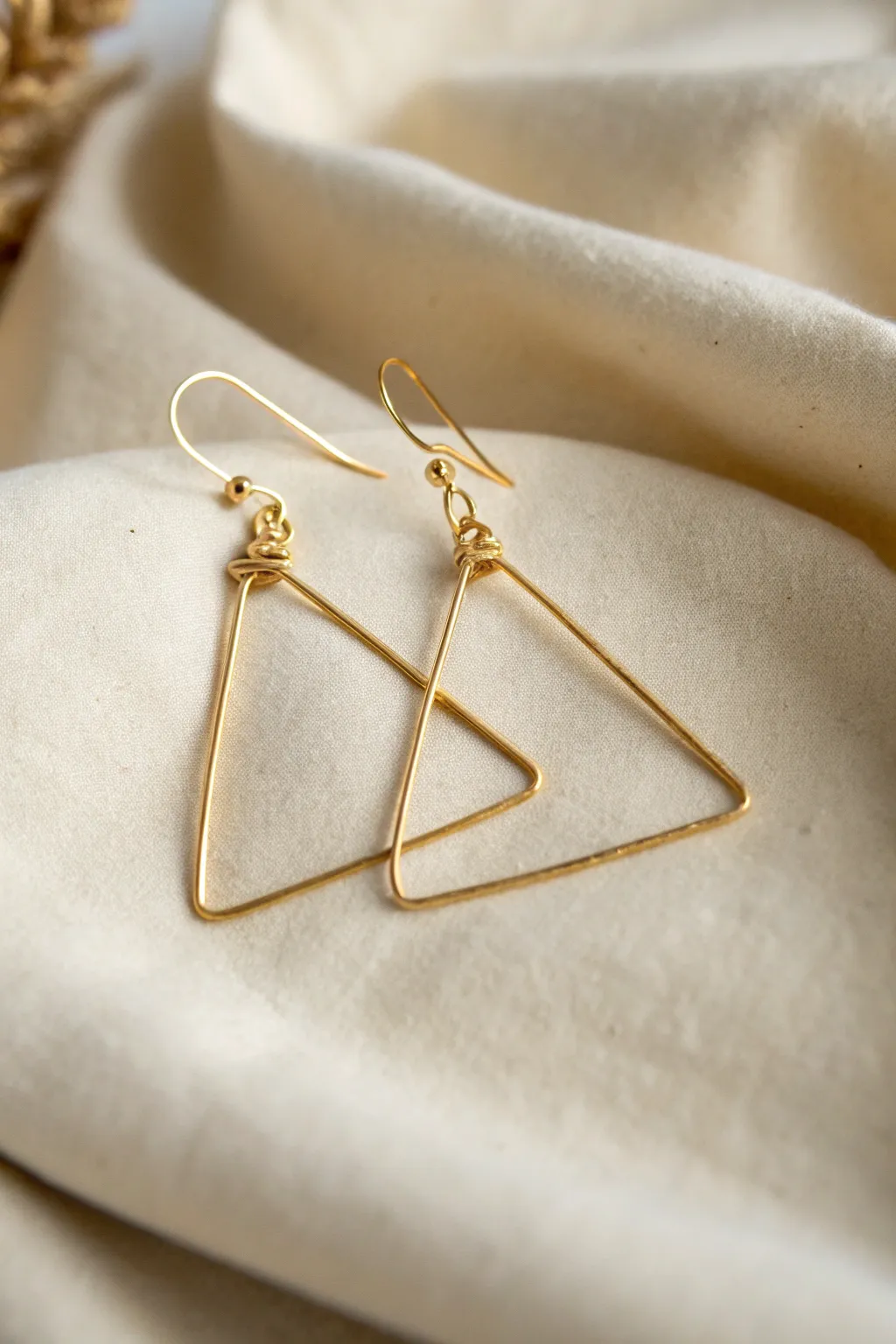 Embrace elegance with minimalist wire art earrings – a touch of simplistic beauty for any look.