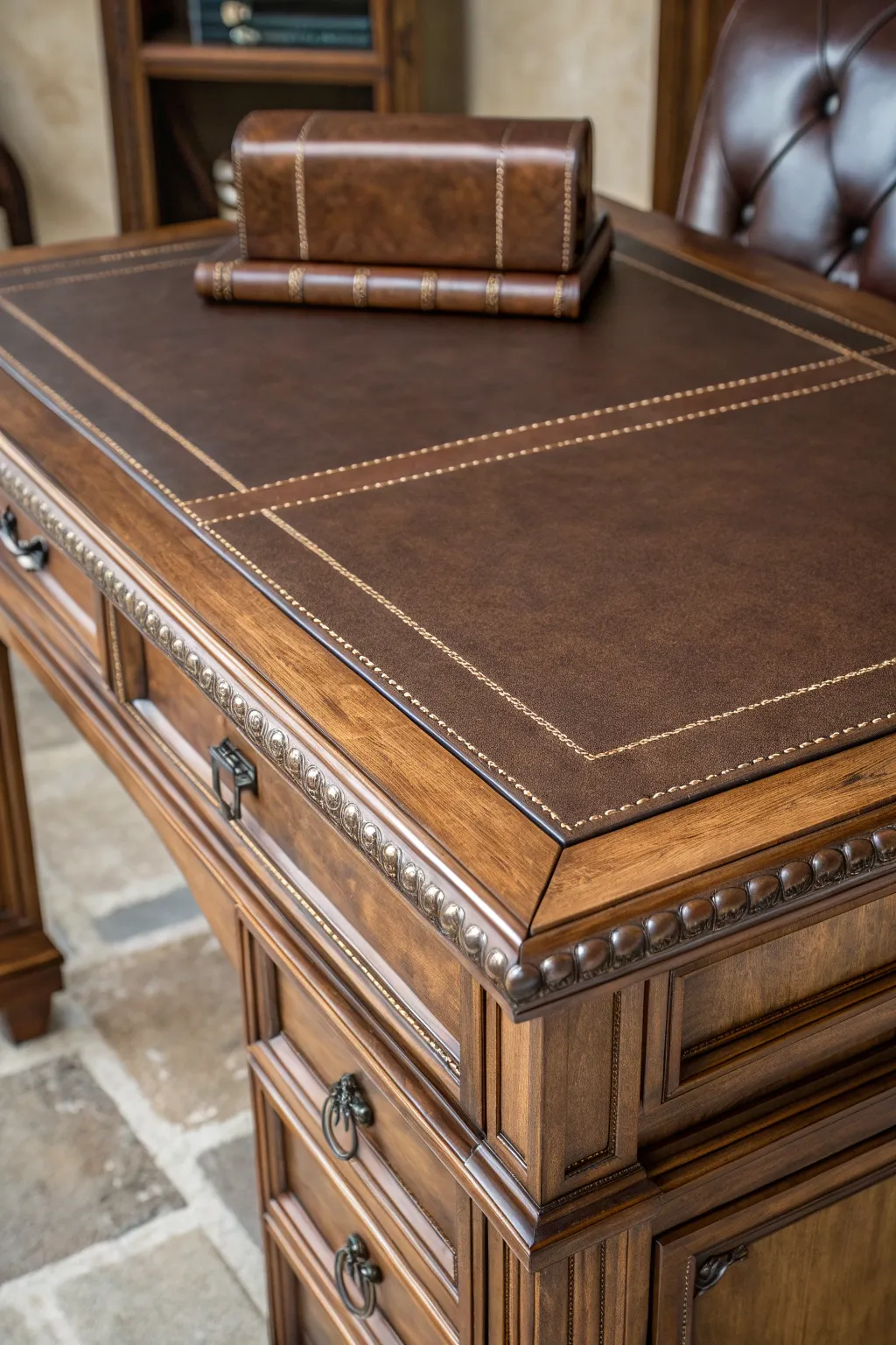 Elevate your workspace with the timeless elegance of a leather-topped desk.