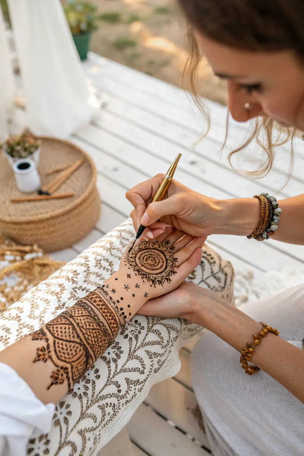 Captivate your guests with the timeless beauty of henna artistry at your boho backyard gathering.