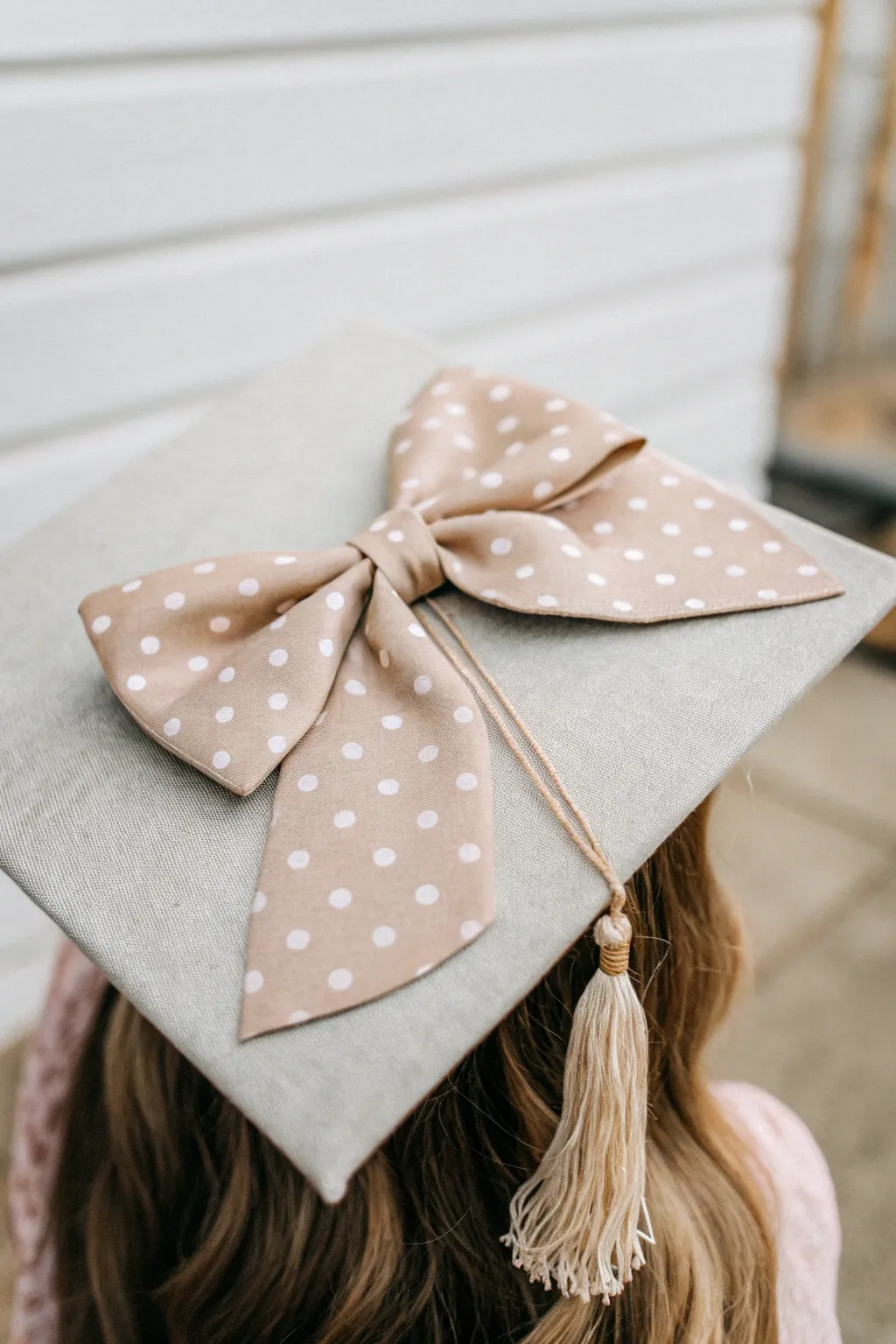 Embrace whimsy with a charming bow for your graduation cap!