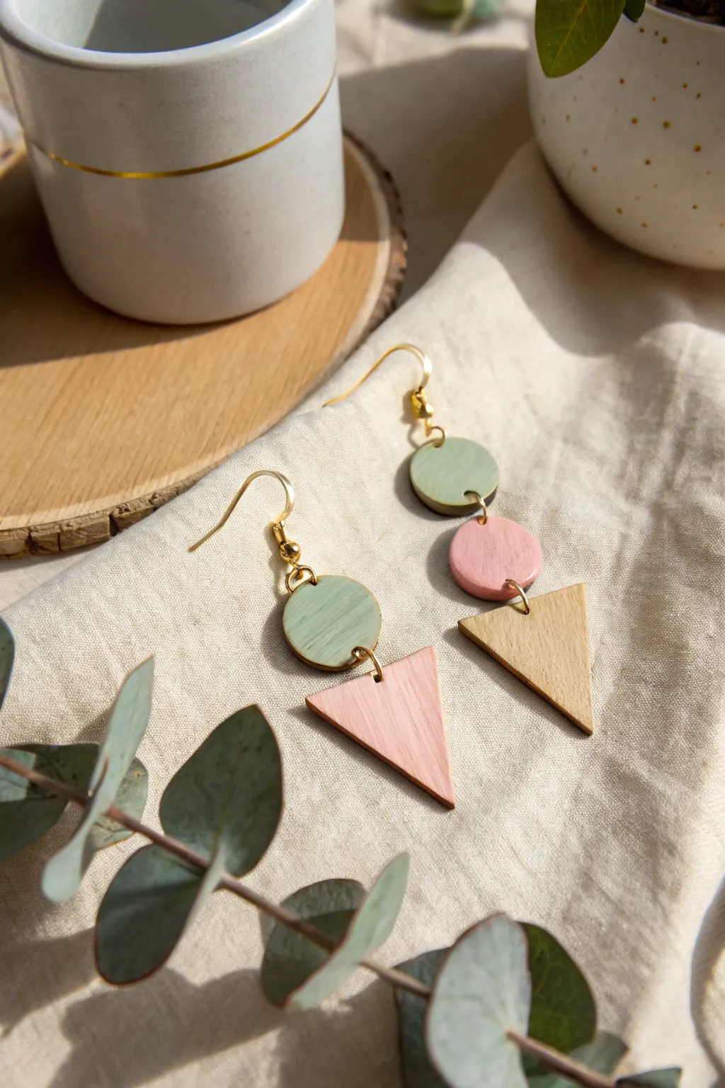 Embrace minimalist elegance with these DIY geometric wooden earrings. Perfect for adding a touch of Scandinavian charm to any outfit!