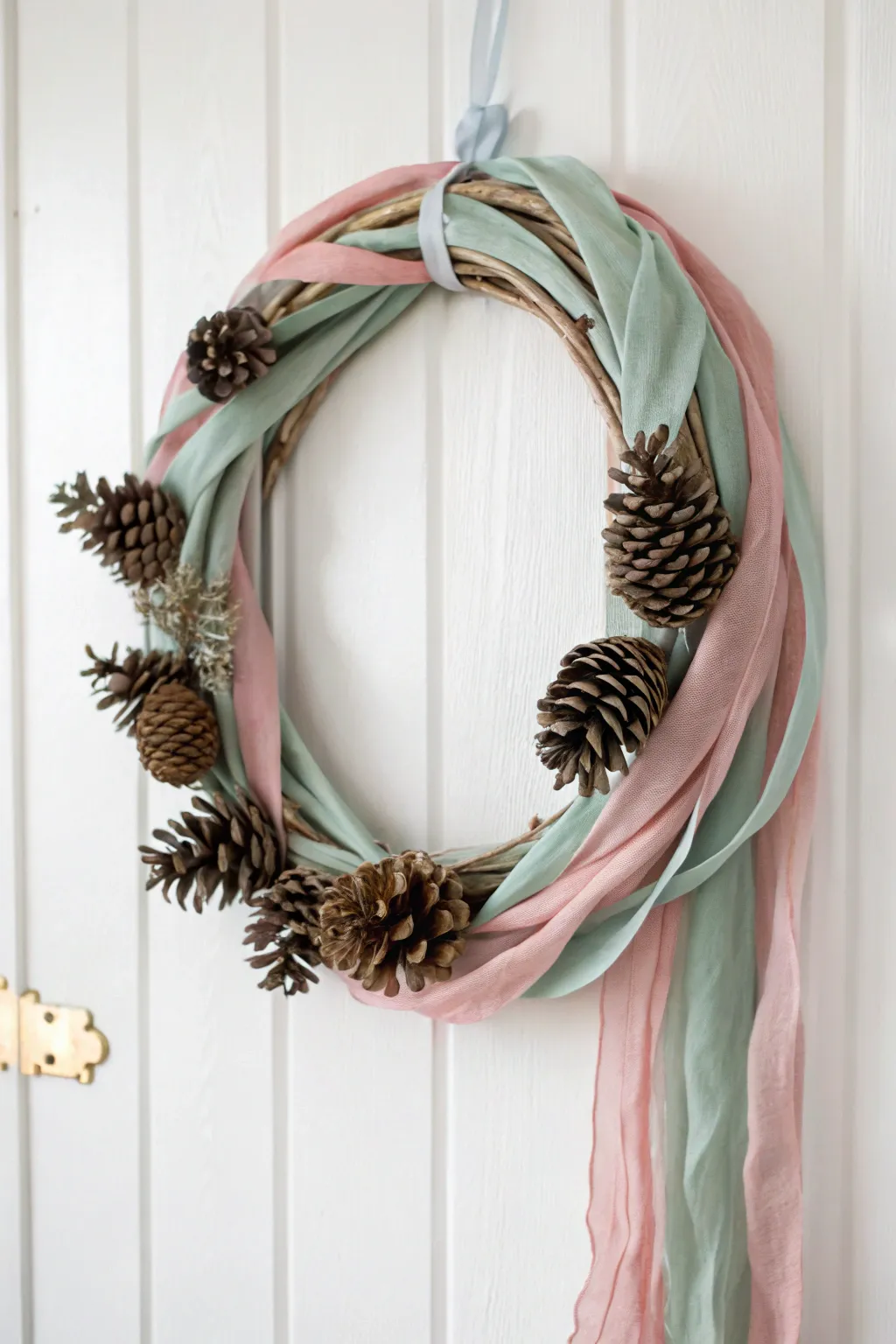 Elevate your home decor with a charming Pinecone and Fabric Wreath – where nature meets elegance in a minimalist design.