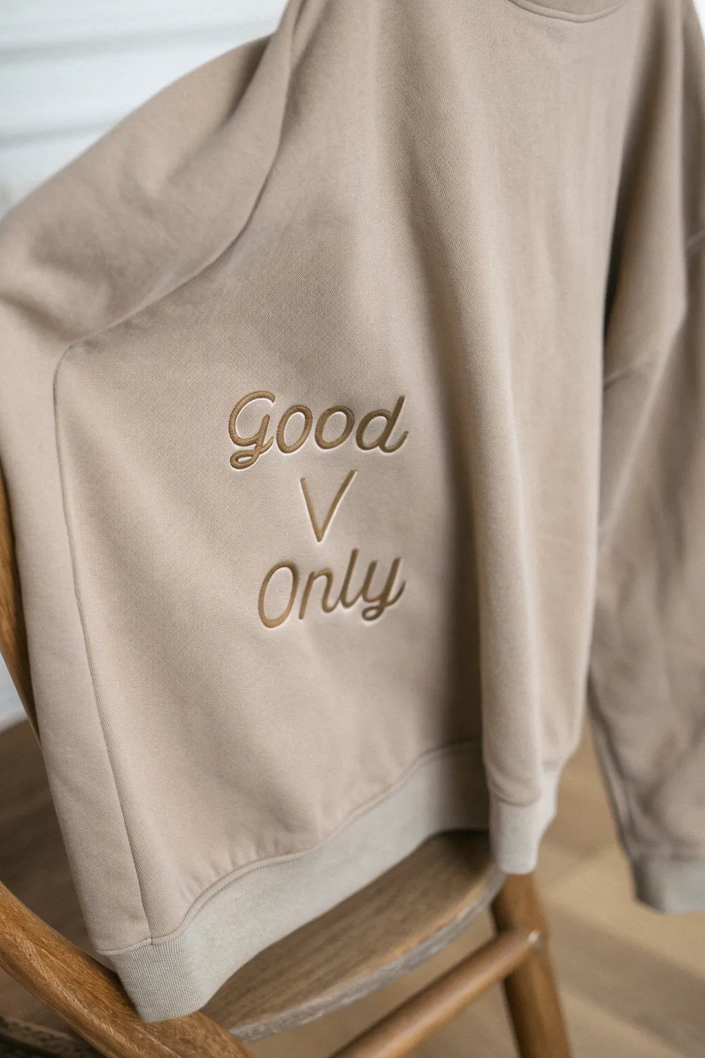 Elevate your style with minimalist elegance and a touch of boho charm: 'Good Vibes Only' embroidered sweatshirt.