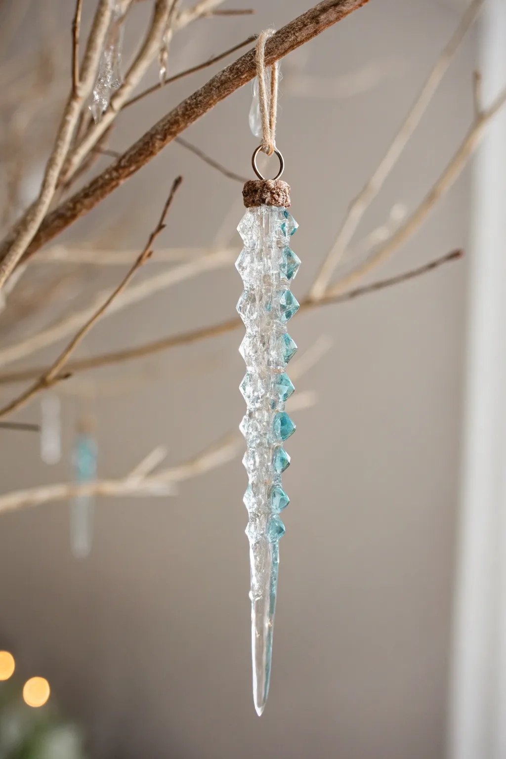 Embrace the elegance of simplicity with handcrafted glass icicle ornaments that shimmer with every twinkle of the fairy lights.
