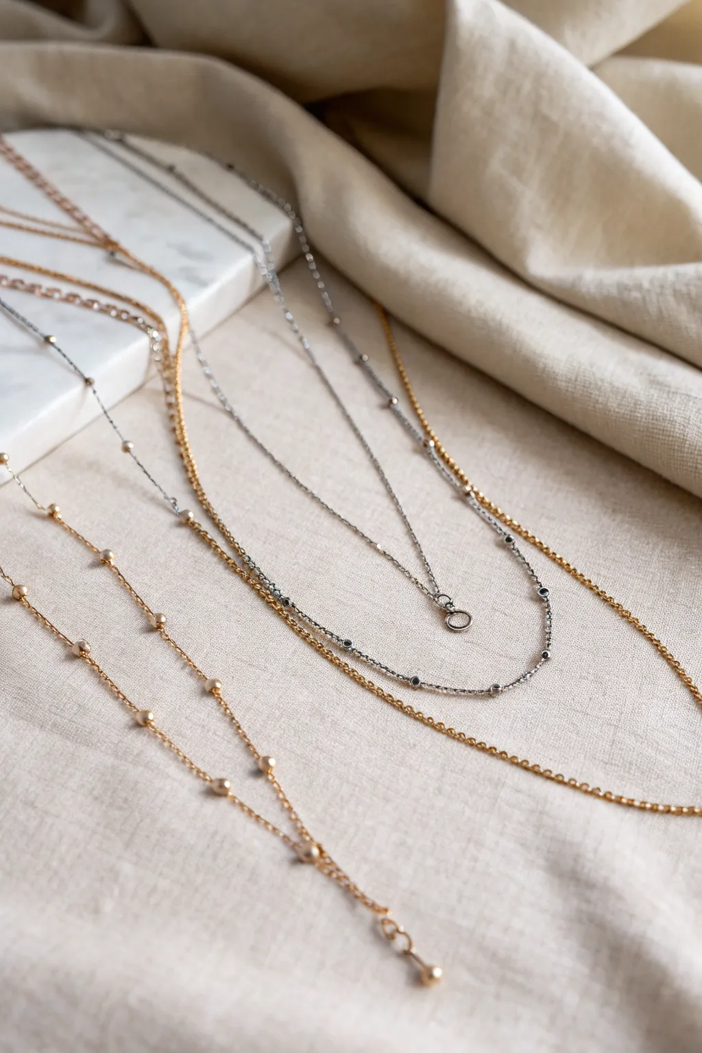 Elevate your style with the art of layering: Discover the charm of minimalist metal necklaces.
