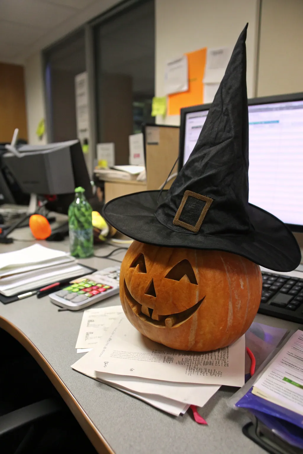 A mystical witch's hat pumpkin, bewitching the office with its charm.