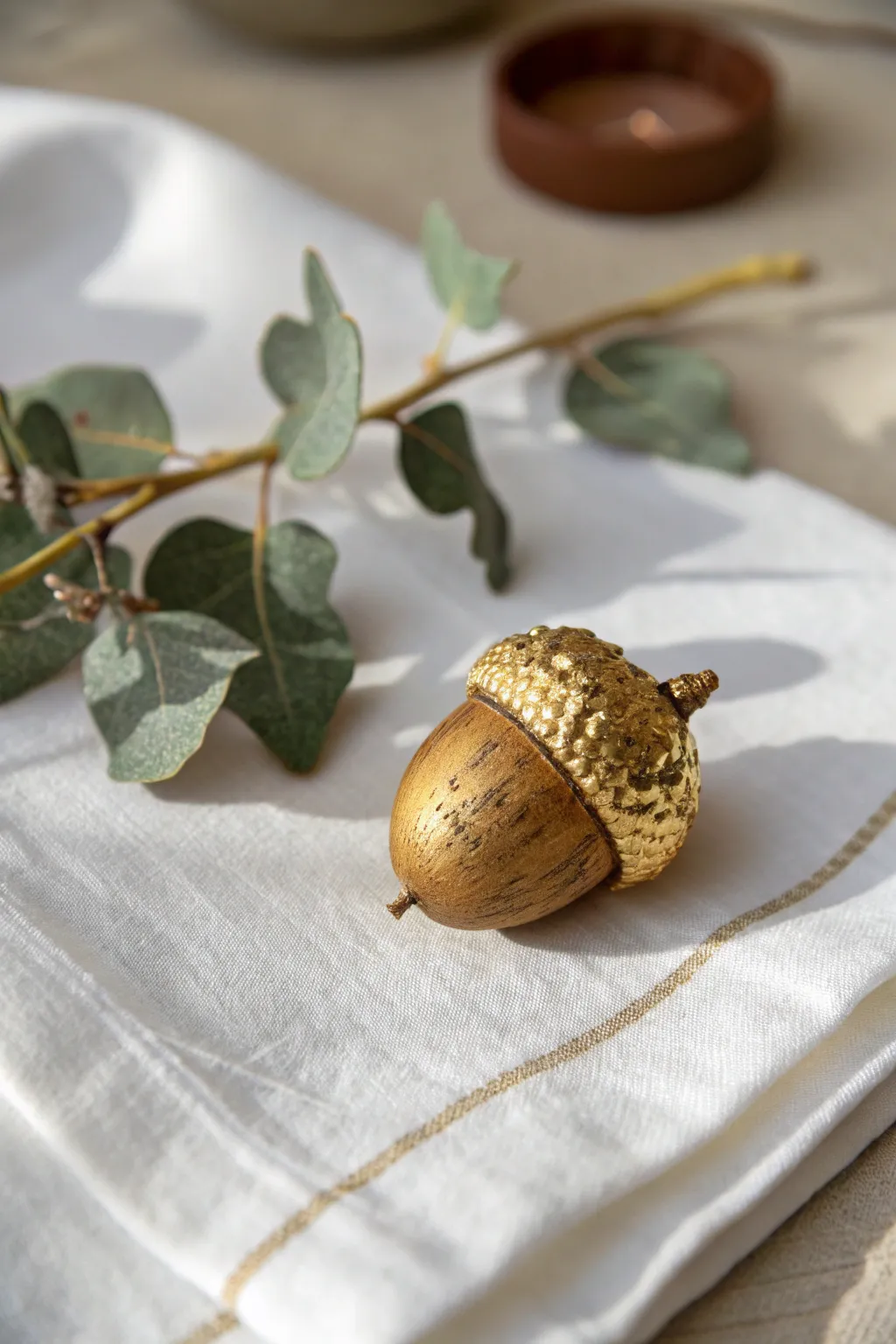 Discover the luxury of nature with this gilded acorn, perfect for adding a touch of elegance to your decor.