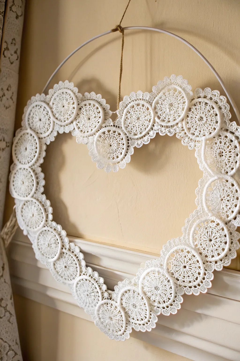 Welcome guests with a touch of handcrafted love: A minimalist doily heart wreath that embodies simplicity and elegance.