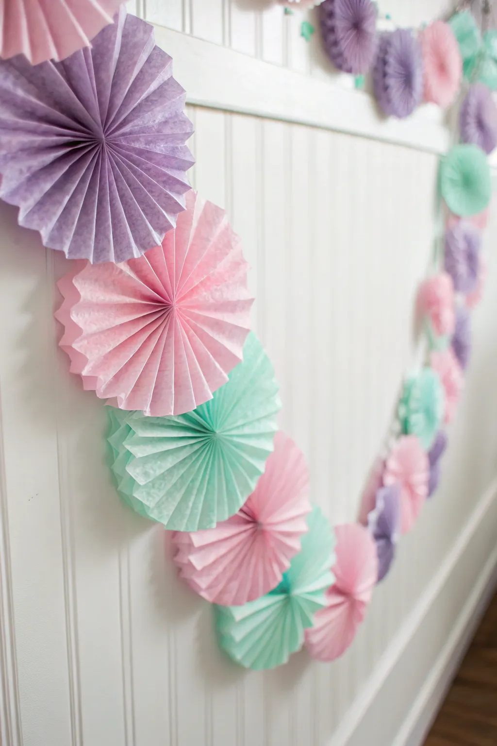 Transform ordinary coffee filters into a stunning pastel backdrop for your next gathering!