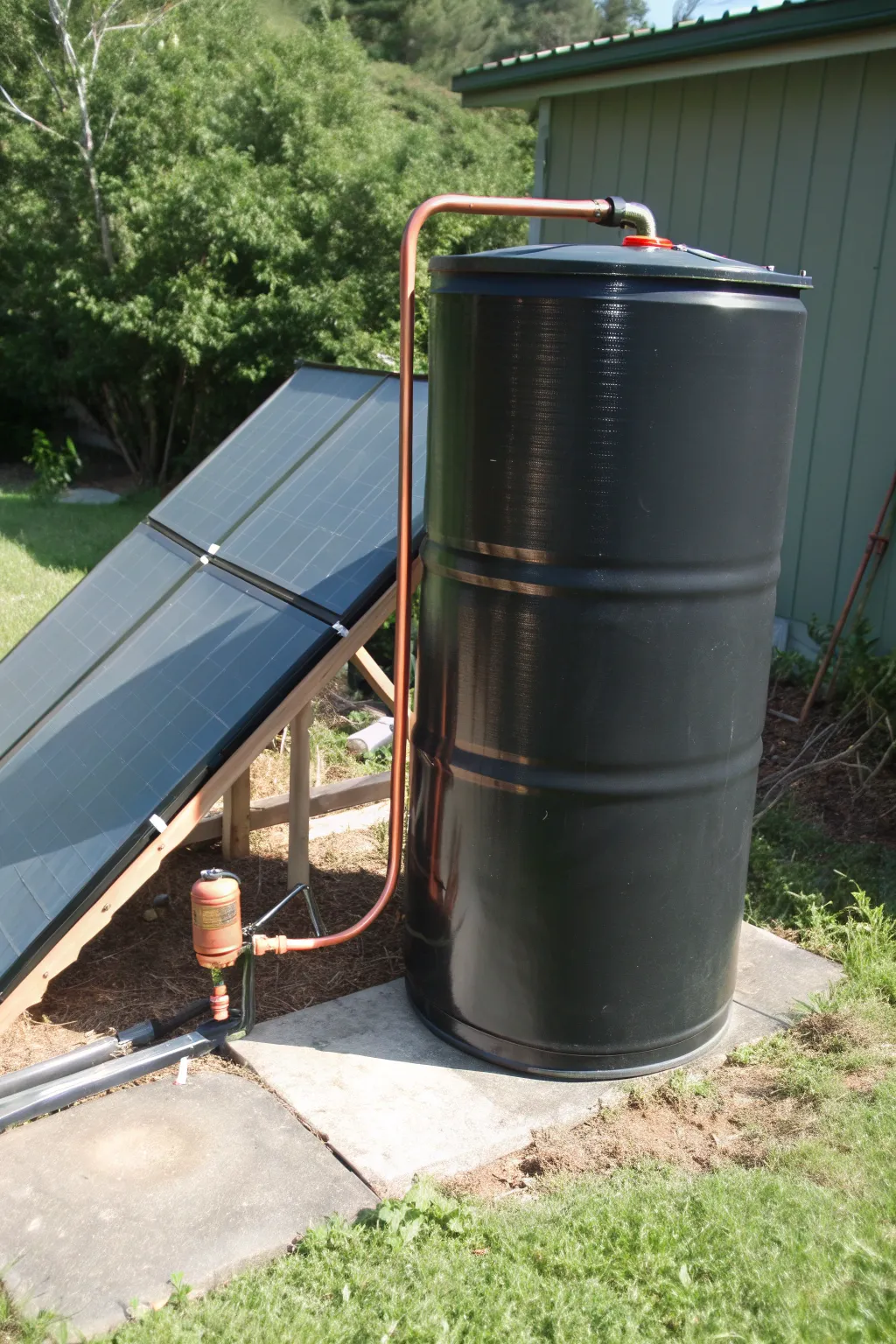 Harness the sun's power with a DIY solar water heater crafted from a 55-gallon drum.