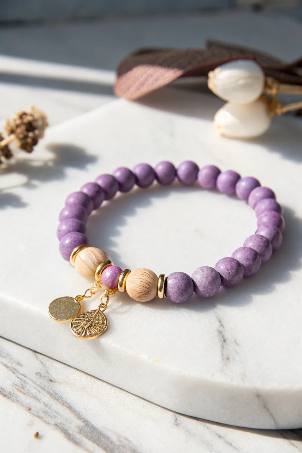 Discover the playful elegance of charm clusters with this beautifully crafted purple clay bead bracelet.