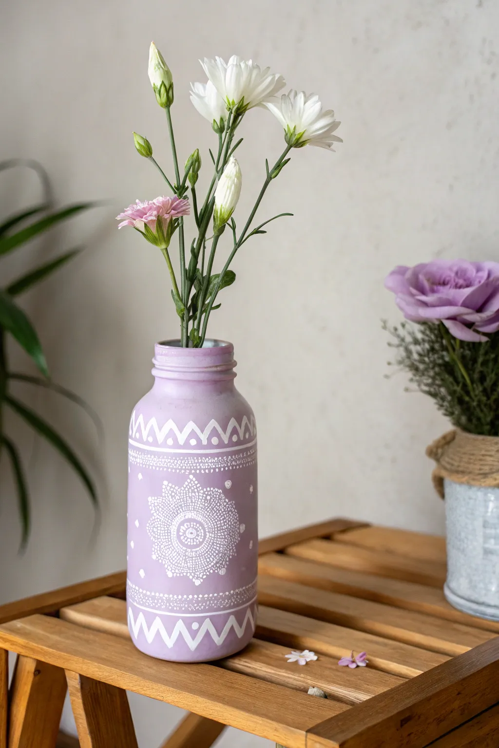 Transform old jars into chic purple vases for a touch of artisanal elegance in your space.