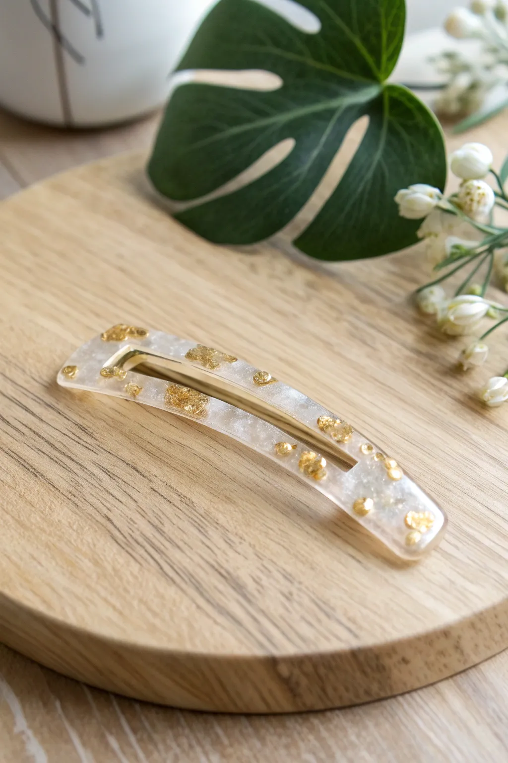 Add a touch of shimmer to your style with this chic resin hair accessory!