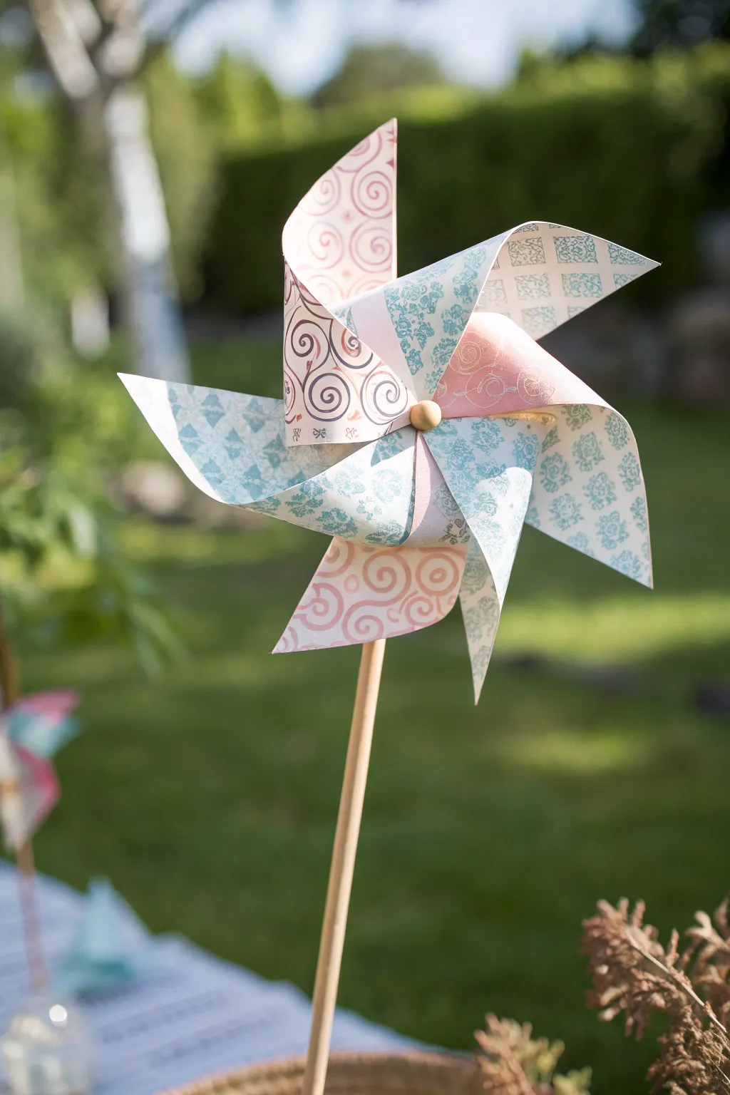 Add a touch of whimsy to your garden with these charming DIY paper pinwheels.