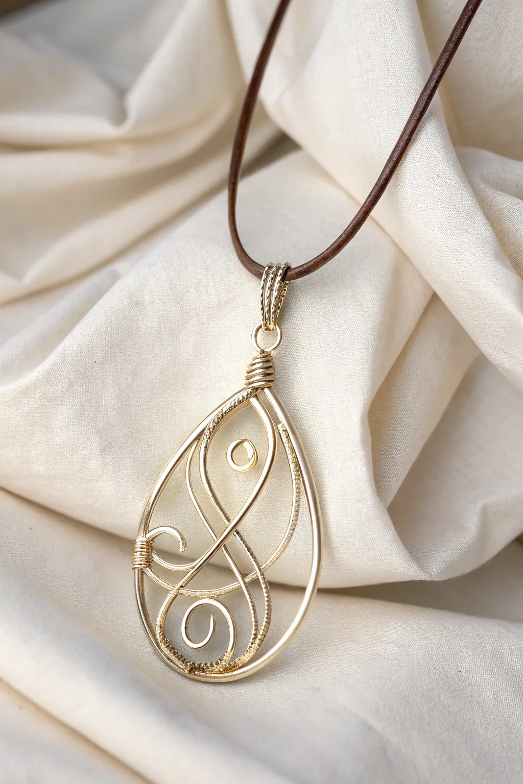 Embrace the art of simplicity with this stunning abstract wire-wrapped pendant, where craftsmanship meets natural beauty.