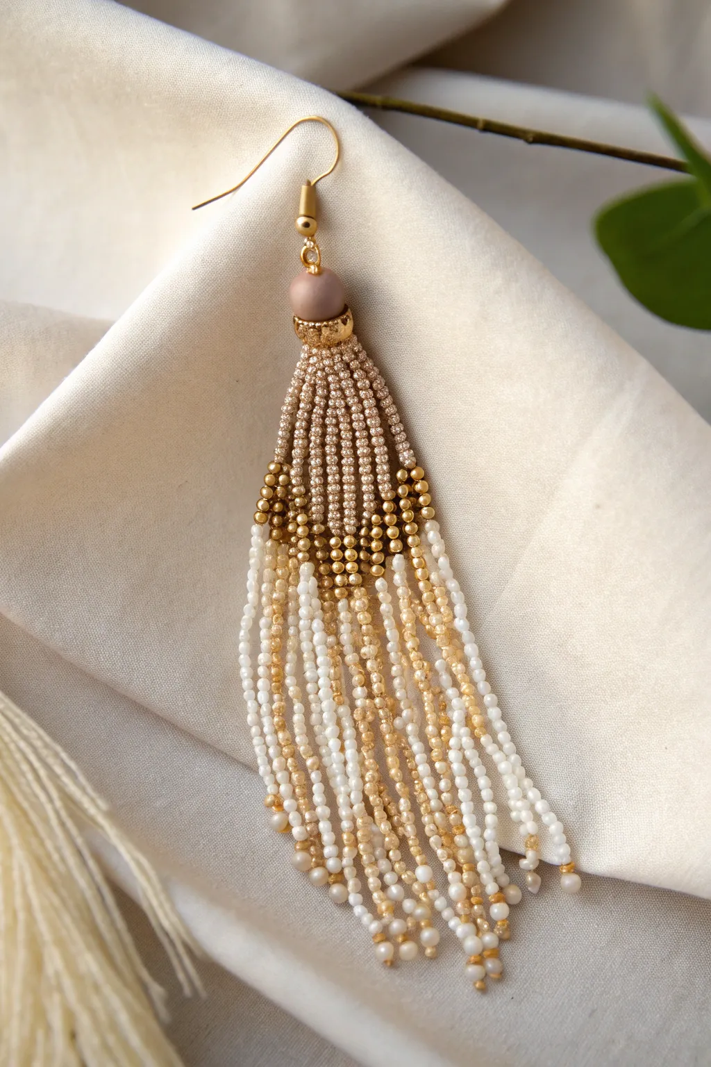 Elevate your style with the playful elegance of beaded fringe earrings. #MinimalistChic #BohoBeauty