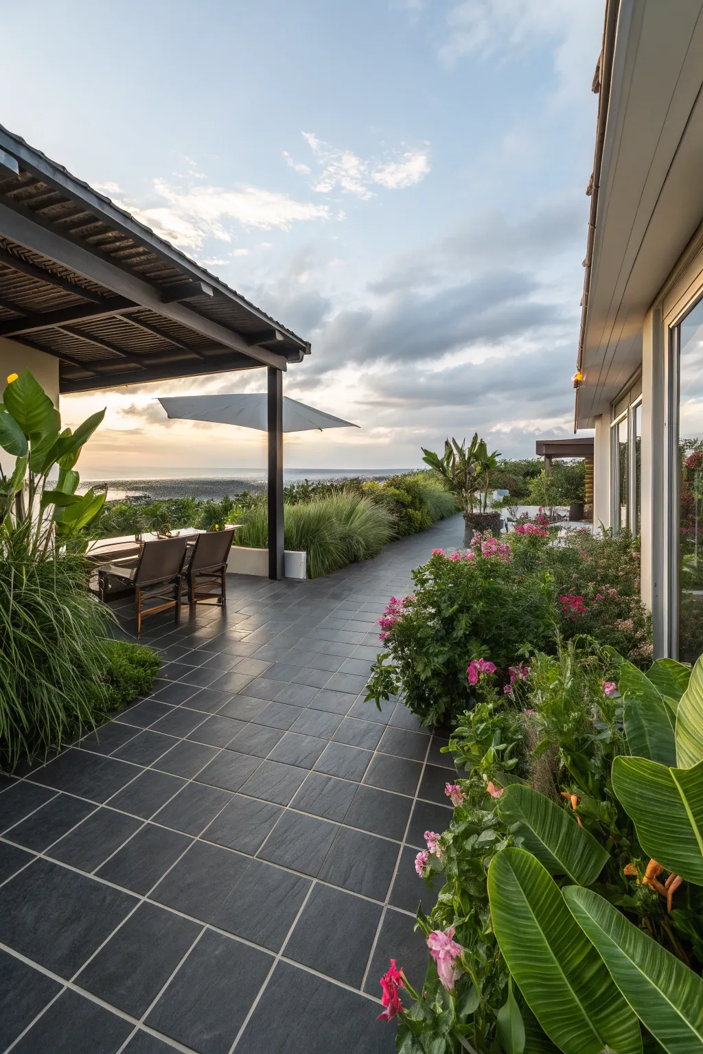 Seamless indoor-outdoor transition with dark tiles.