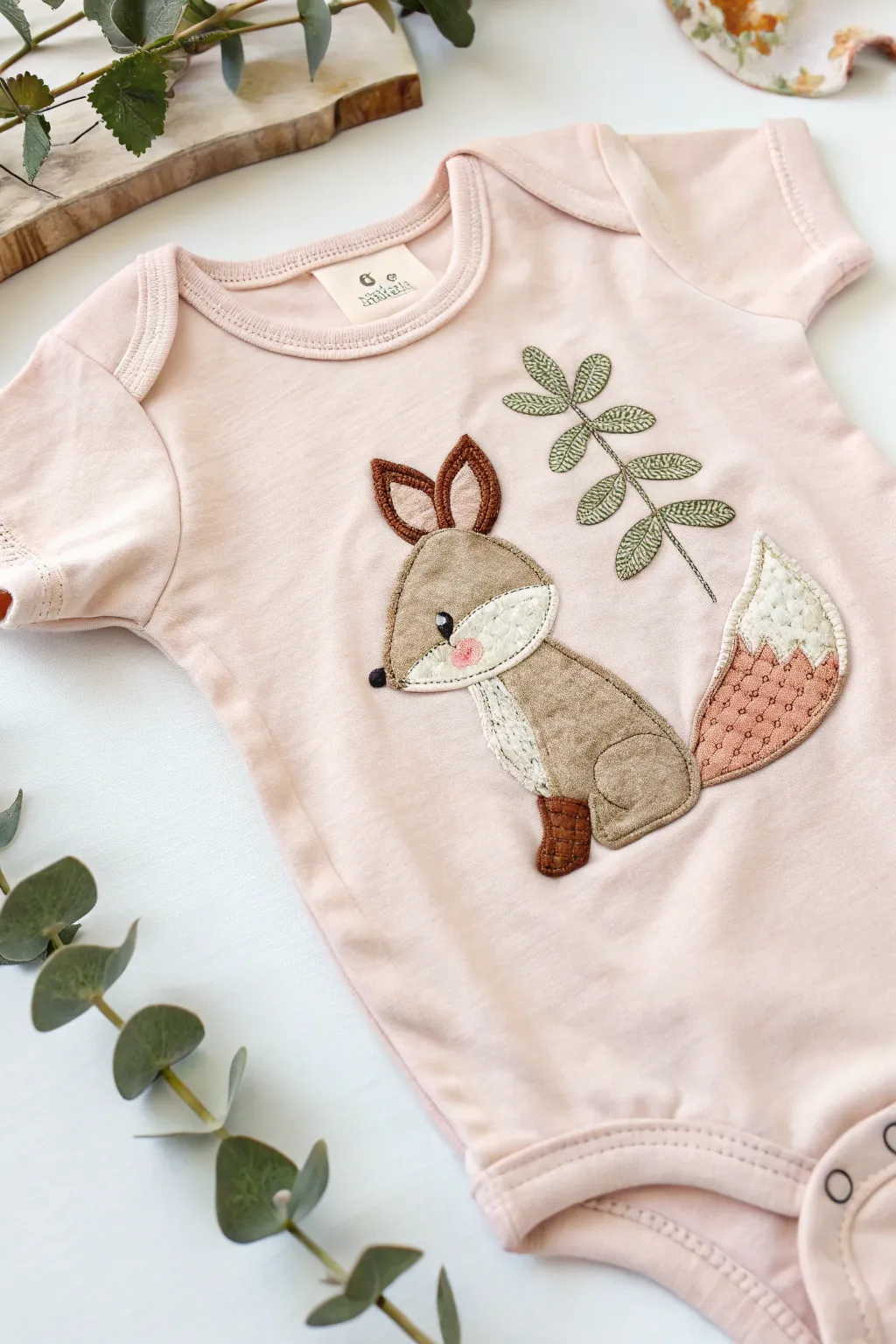 Crafting charm: Transform your baby’s onesie with delightful applique designs that add a playful touch of texture and creativity.
