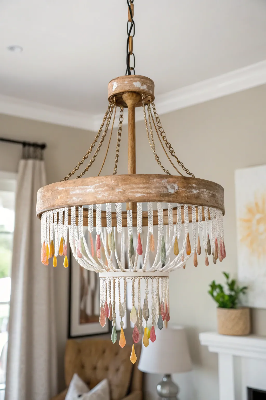 Transform your space with a touch of artistic elegance: a stunning DIY chandelier with metallic paint drips.