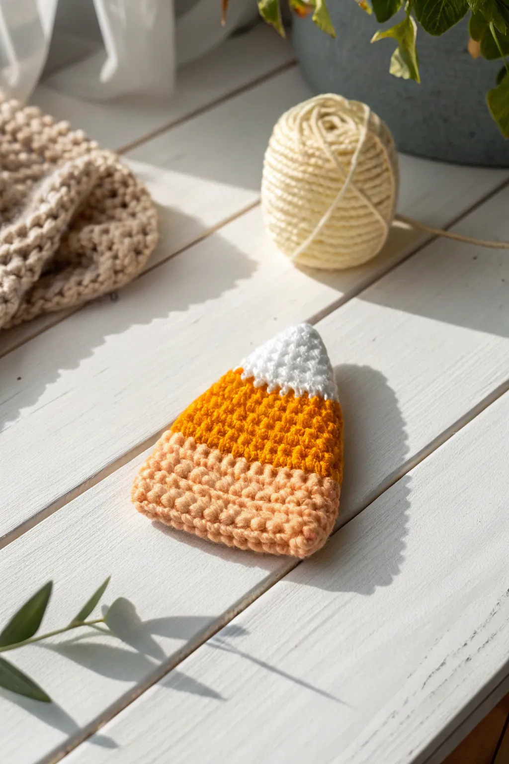 Embrace the cozy charm of handmade candy corn crochet for a delightful fall touch.