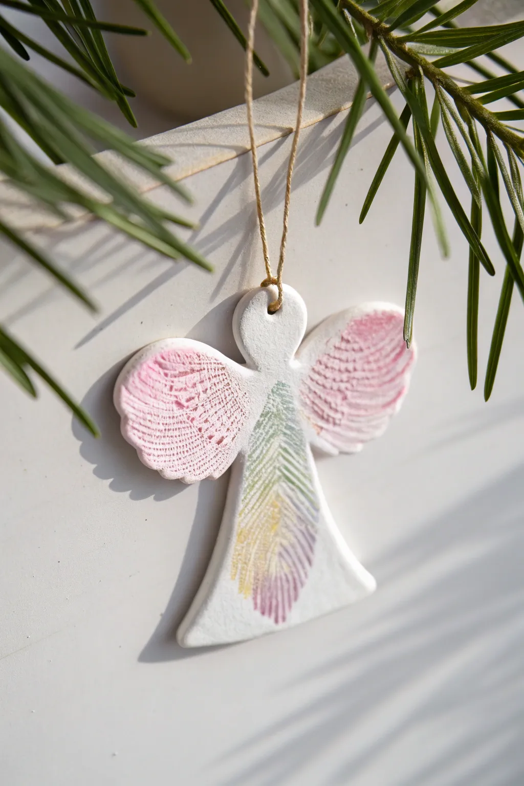 Embrace the celestial elegance of handcrafted fingerprint angels, where simplicity meets divine artistry.