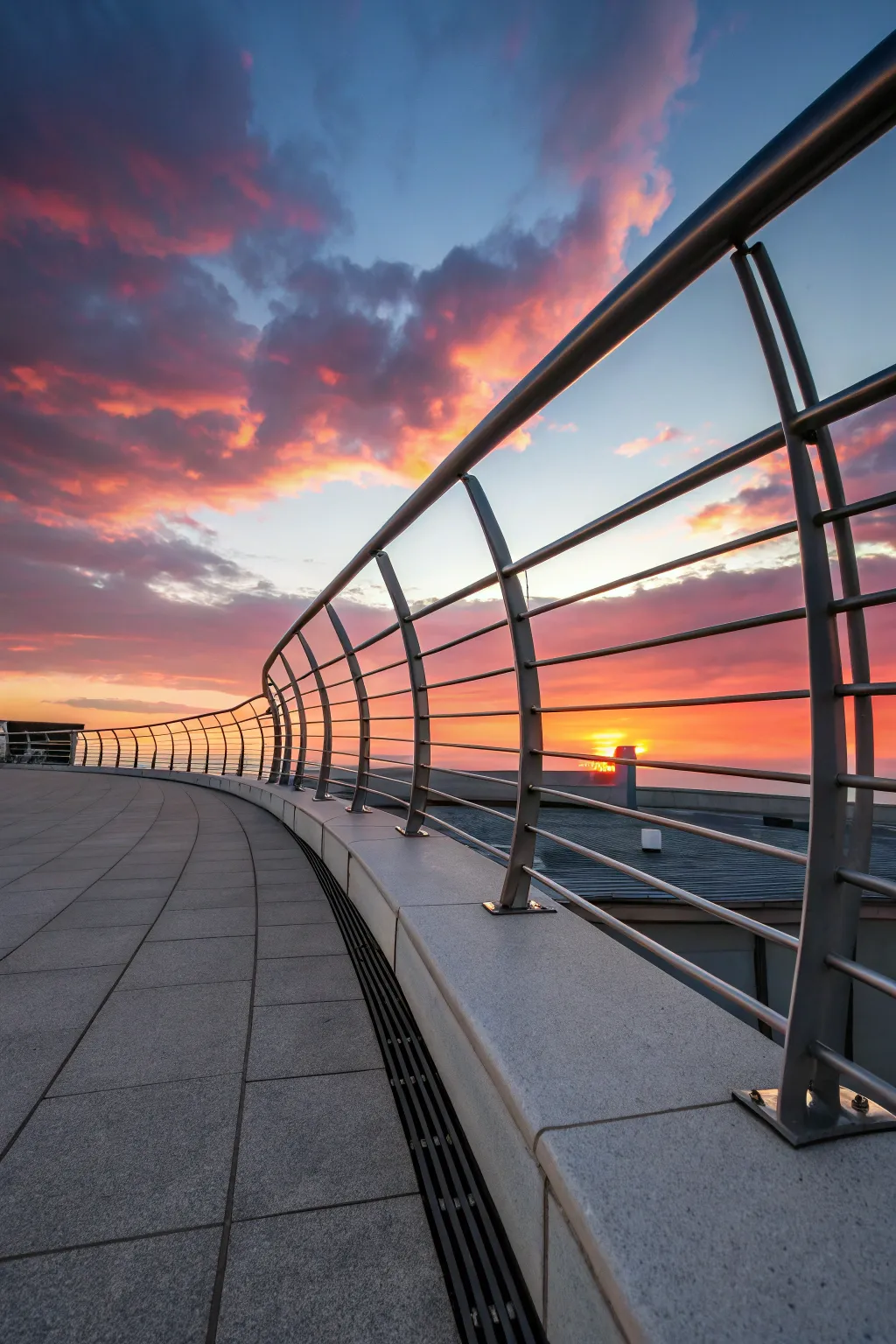 Elevate your rooftop with the elegance of a curved railing, where craftsmanship meets art.
