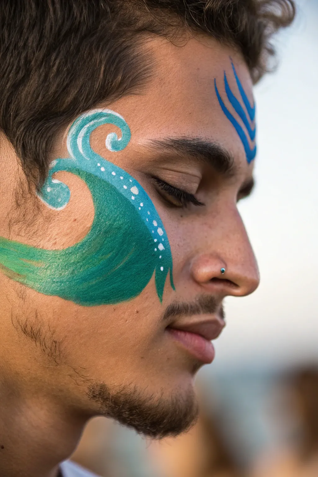Ride the waves with style: dual color face paint for the ultimate game day look.