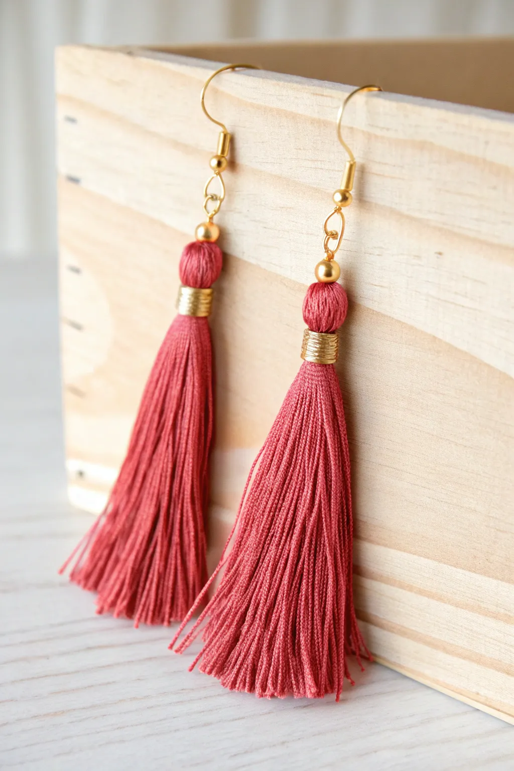 Craft your own stylish tassel earrings for graduation and beyond, merging minimalist elegance with a bold, colorful twist.