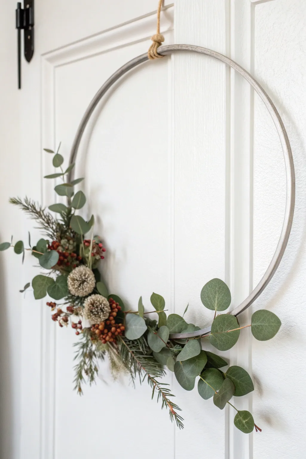 Embrace the beauty of simplicity with a stylish modern hoop wreath, perfect for adding a touch of elegance to any space.