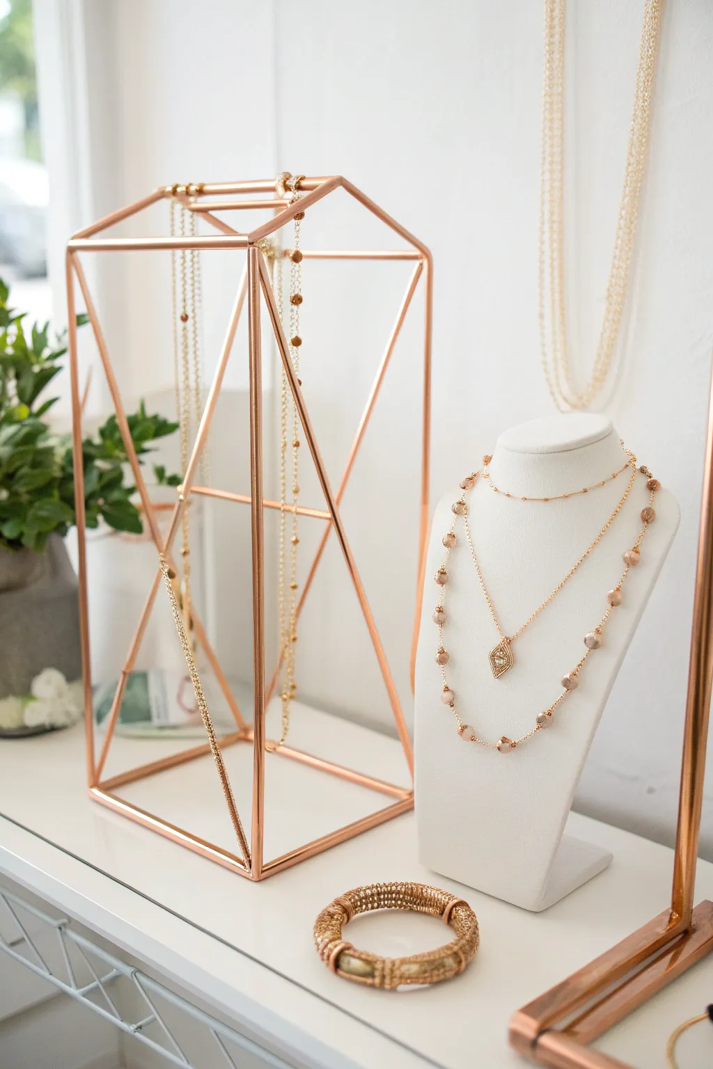 Elevate your jewelry display with the striking elegance of geometric copper pipe stands.