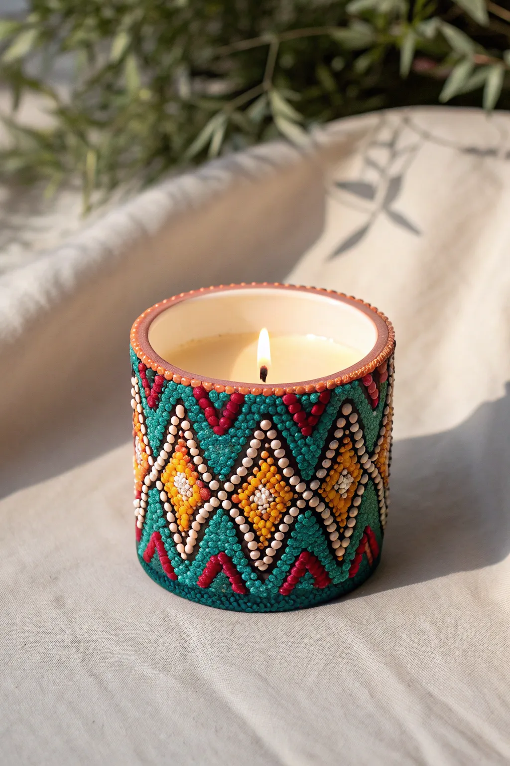 Illuminate your space with handcrafted elegance: a vibrant melting bead candle holder that casts colorful shadows, perfect for cozy evenings.