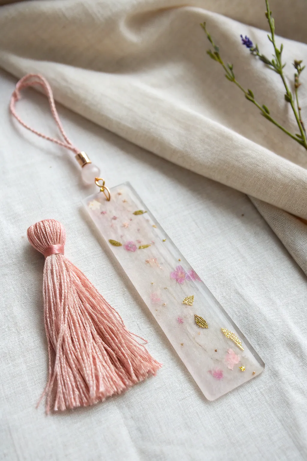 Add a playful touch to your reading with this handcrafted resin bookmark, adorned with a charming tassel.