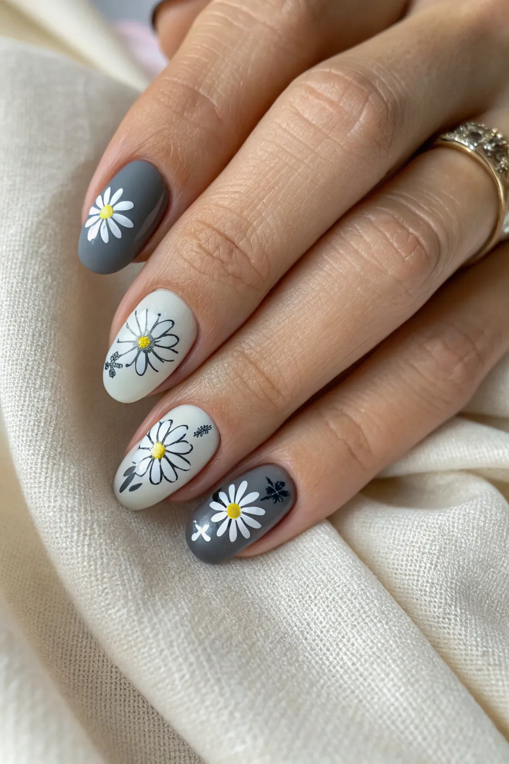 Elevate your style with these chic monochrome daisy nails—where simplicity meets sophistication.