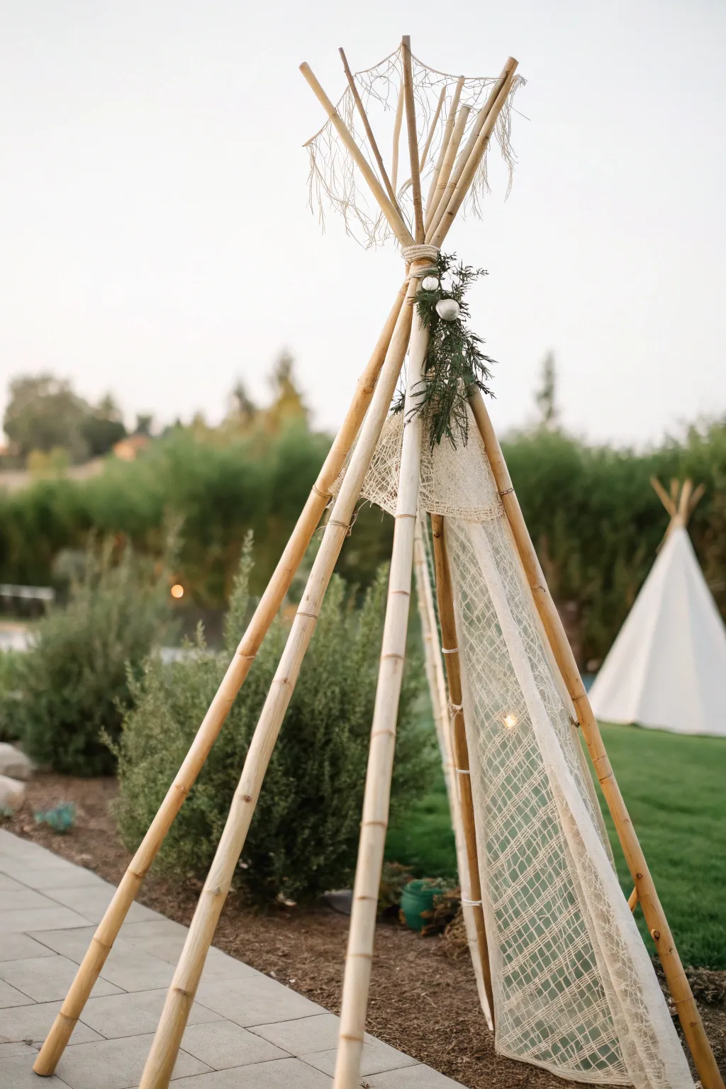 Embrace rustic elegance with a bamboo teepee trellis—where simplicity meets natural beauty.