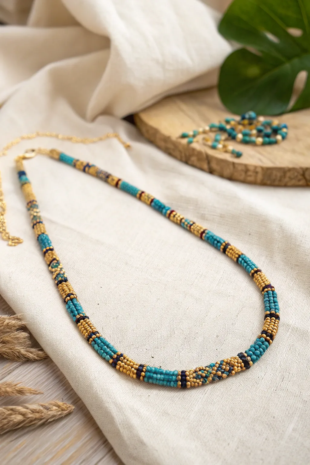 Add a touch of regal elegance to your style with this Egyptian-inspired seed bead necklace.