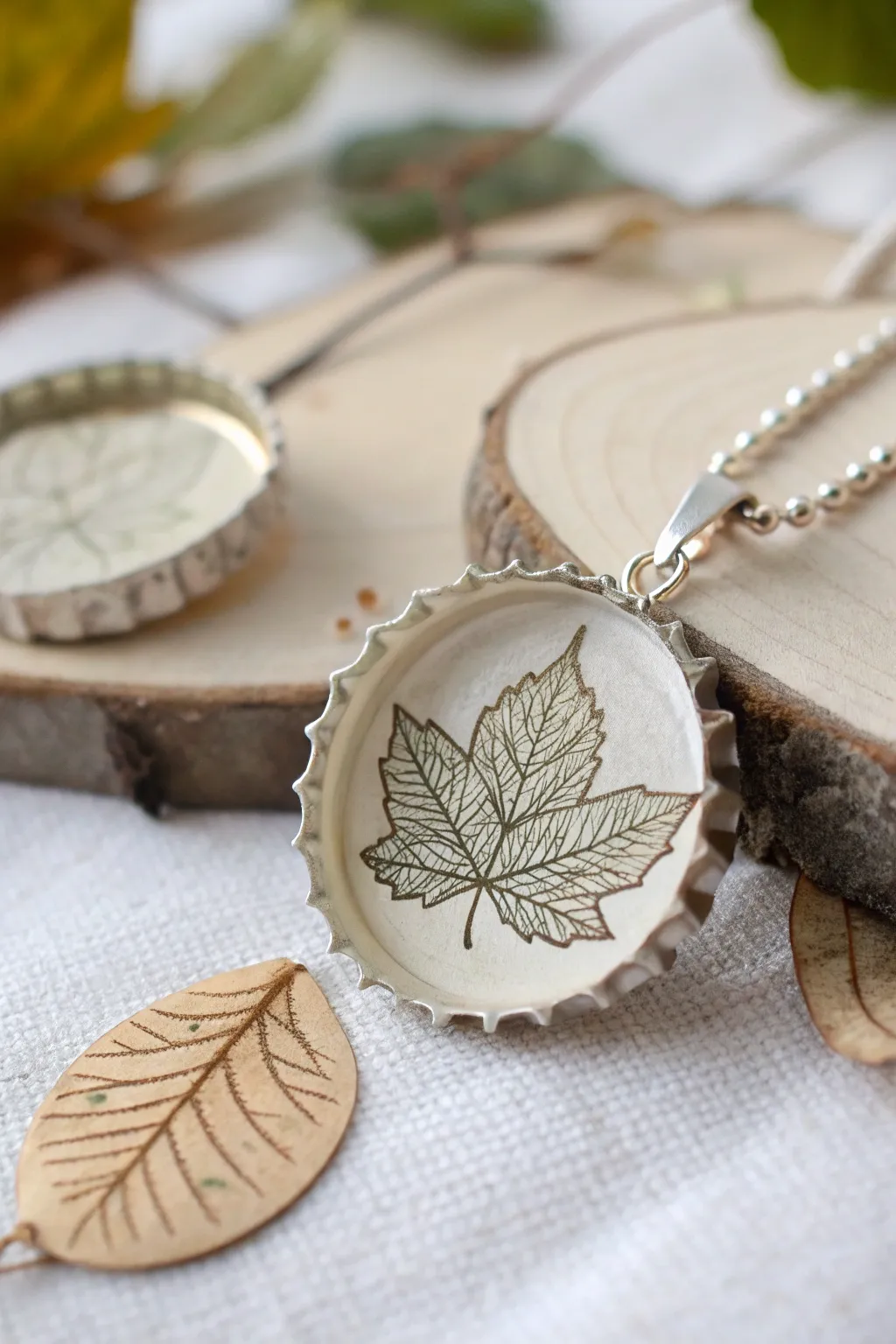 Embrace nature's elegance with leaf-inspired bottle cap jewelry.