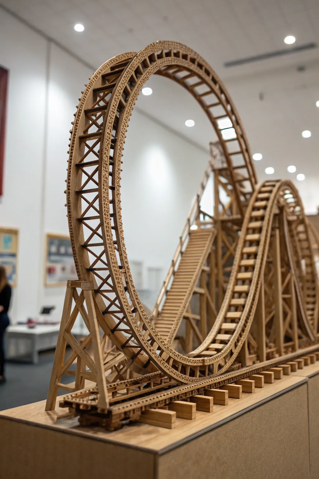 Experience the thrill of craftsmanship with this masterfully designed double loop cardboard roller coaster.